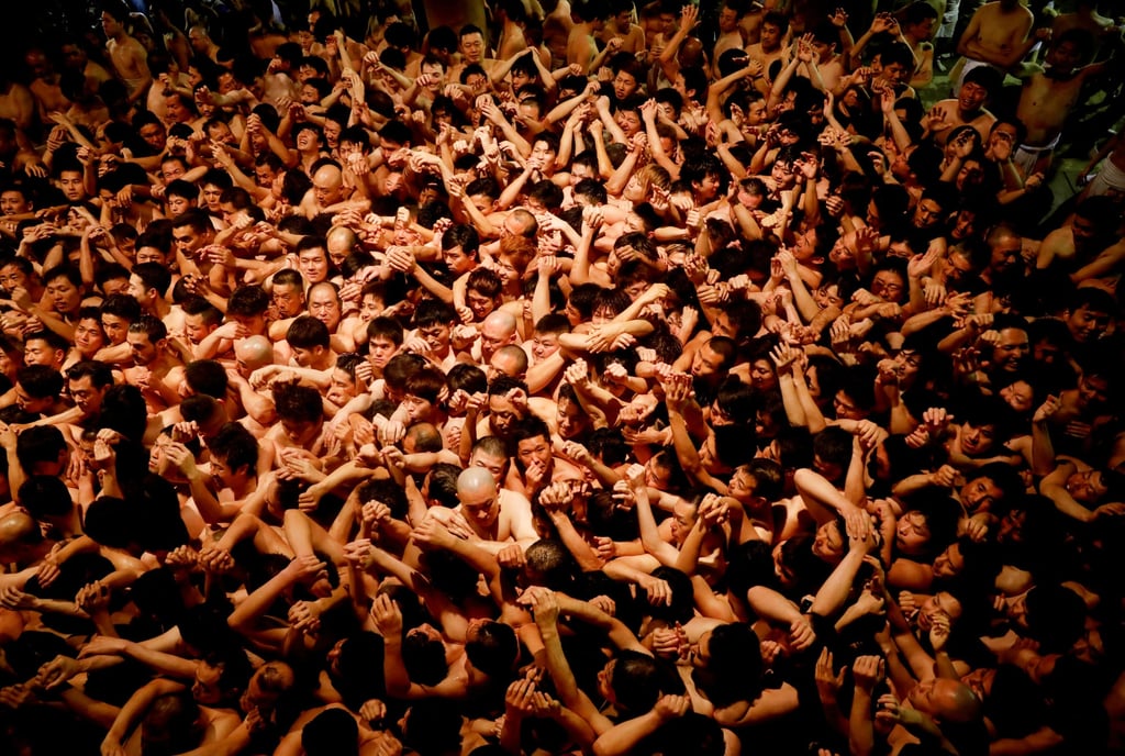Men prepare to snatch a wooden stick during a naked men festival in Japan. The person who grabs the stick is considered the “luckiest man of the year”. Photo: Reuters