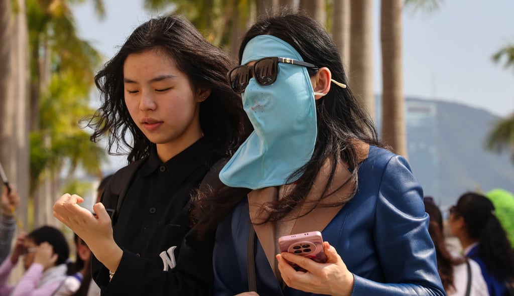 A woman wears a “facekini” as temperatures in the city gradually become warmer. Photo: Jelly Tse A woman wears a “facekini” as temperatures in the city gradually become warmer. Photo: Jelly Tse