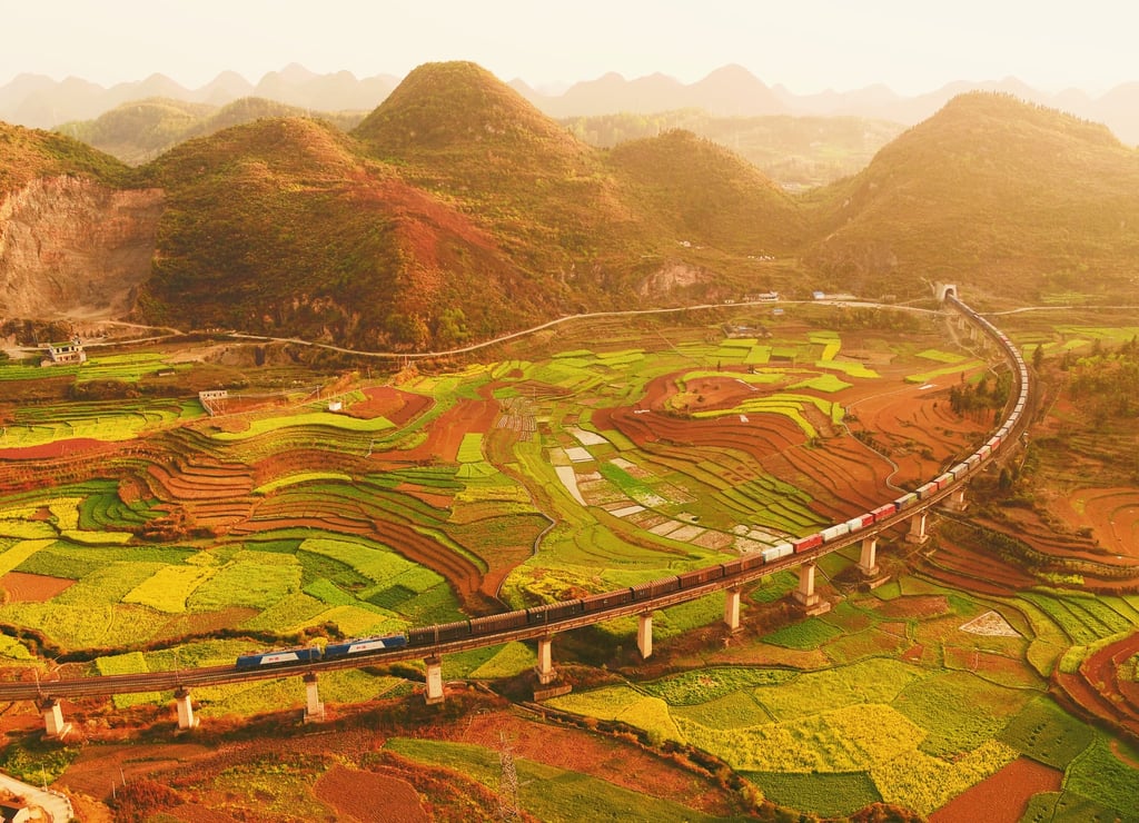 A freight train rolls through the Qianxinan Buyei and Miao autonomous prefecture in Guizhou province, China. Photo: Wang Lu A freight train rolls through the Qianxinan Buyei and Miao autonomous prefecture in Guizhou province, China. Photo: Wang Lu