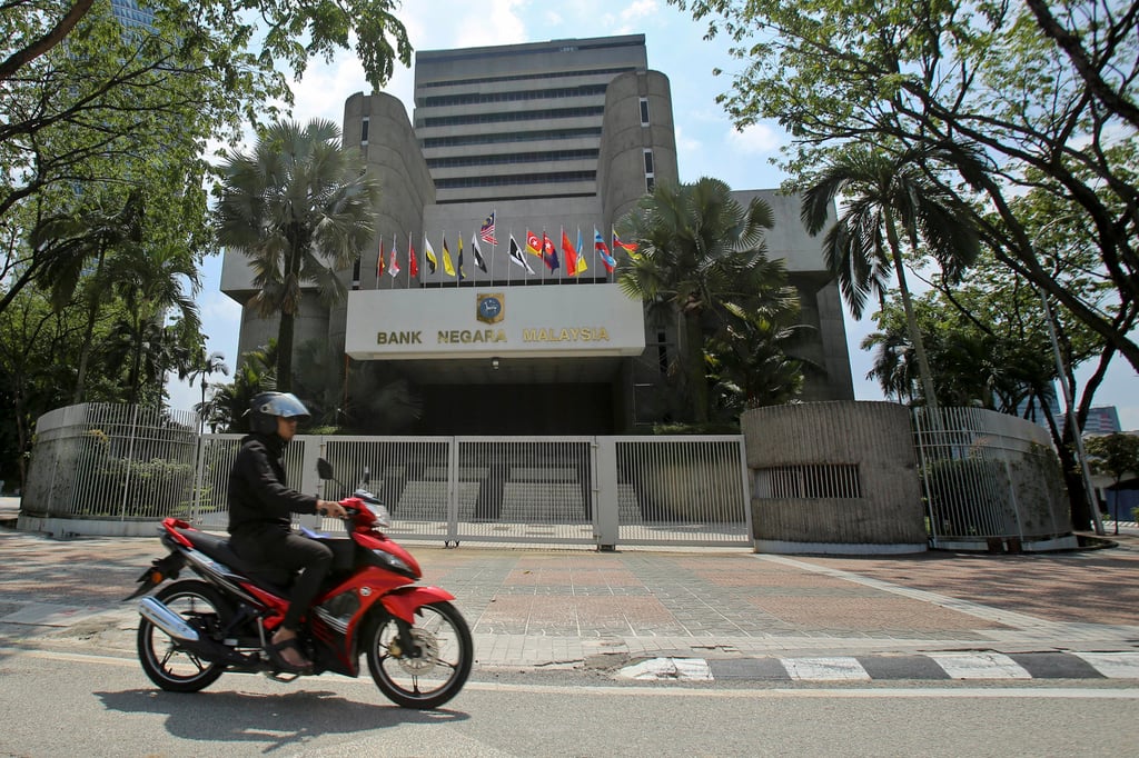 A motorcyclist rides past the Bank Negara Malaysia in Kuala Lumpur. The government expects Malaysia’s economy to grow by 4 to 5 per cent this year, up from expectations of 4 per cent last year. Photo: AP A motorcyclist rides past the Bank Negara Malaysia in Kuala Lumpur. The government expects Malaysia’s economy to grow by 4 to 5 per cent this year, up from expectations of 4 per cent last year. Photo: AP