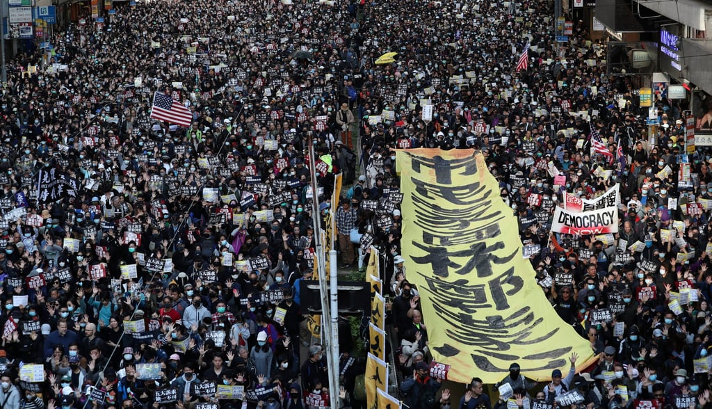 Protesters march from Causeway Bay to Central on the eve of the six month anniversary of the start of the 2019 unrest. Photo: Robert Ng Protesters march from Causeway Bay to Central on the eve of the six month anniversary of the start of the 2019 unrest. Photo: Robert Ng