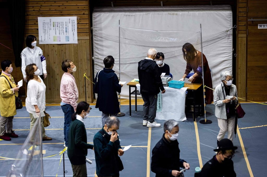 Voters queue to cast their ballots for Japan’s general election in Tokyo on October 31, 2021. Support for the ruling Liberal Democratic Party stood at 24 per cent last month, the lowest since it returned to power in 2012. Photo: AFP Voters queue to cast their ballots for Japan’s general election in Tokyo on October 31, 2021. Support for the ruling Liberal Democratic Party stood at 24 per cent last month, the lowest since it returned to power in 2012. Photo: AFP