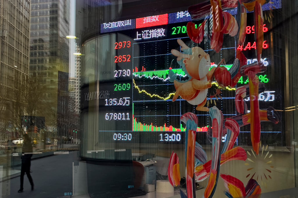 A brokerage’s office window in Beijing on February 5. Chinese stocks have risen in the two days after the Lunar New Year holiday. Photo: AP Photo