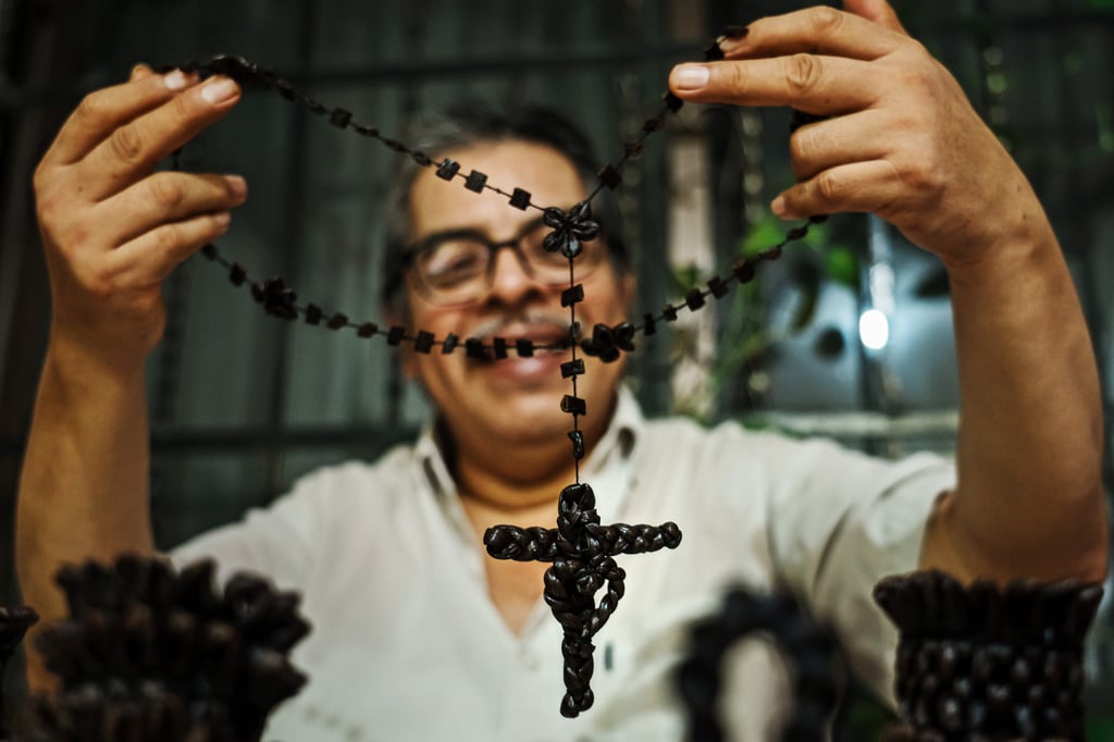 Lucio Olmos Morales shows off artisan designs made out of vanilla bean stalks at his home in Papantla, Mexico. Photo: TNS