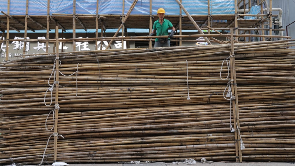 A construction worker at a site in Yau Ma Tei. Hong Kong is one of the few places left in the world that uses bamboo scaffolding. Photo: Jelly Tse A construction worker at a site in Yau Ma Tei. Hong Kong is one of the few places left in the world that uses bamboo scaffolding. Photo: Jelly Tse