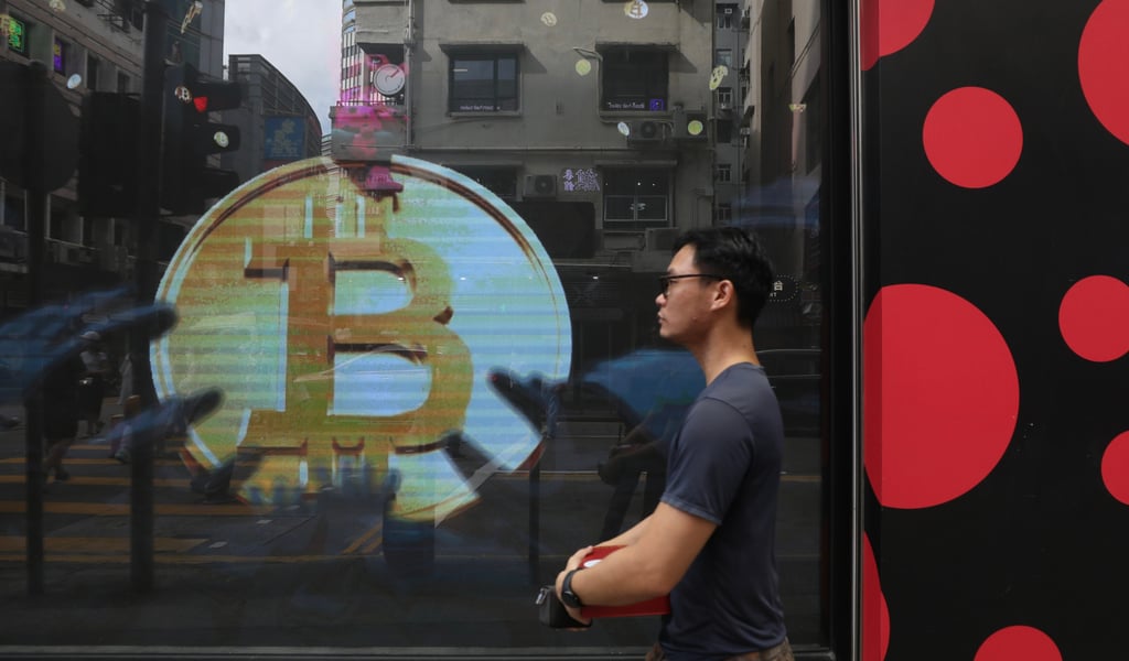 A bitcoin signage on a store in Tsim Sha Tsui. Police handled 5,105 reports of online investment fraud in 2023. Photo: Xiaomei Chen A bitcoin signage on a store in Tsim Sha Tsui. Police handled 5,105 reports of online investment fraud in 2023. Photo: Xiaomei Chen