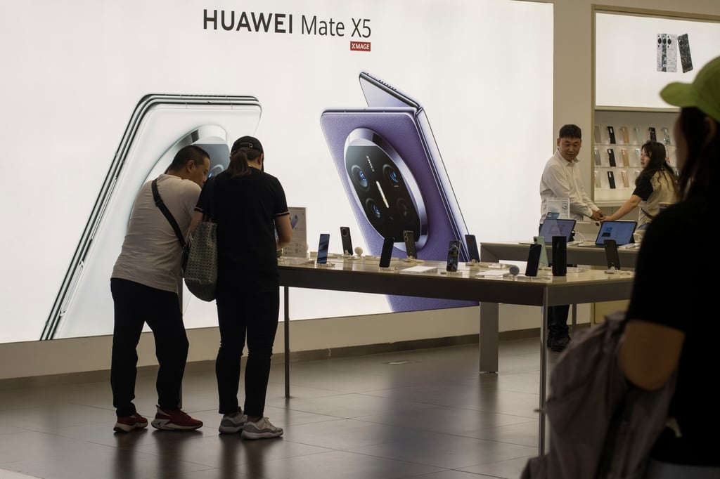 Shoppers check out Huawei Technologies’ Mate X5 foldable smartphone, built with an advanced Kirin chip and Hasselblad camera, at one of the company’s stores in Beijing on September 27, 2023. Photo: Shutterstock