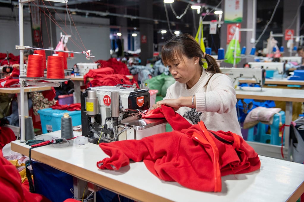 Workers produce garments at a workshop in China. Photo: Getty Images