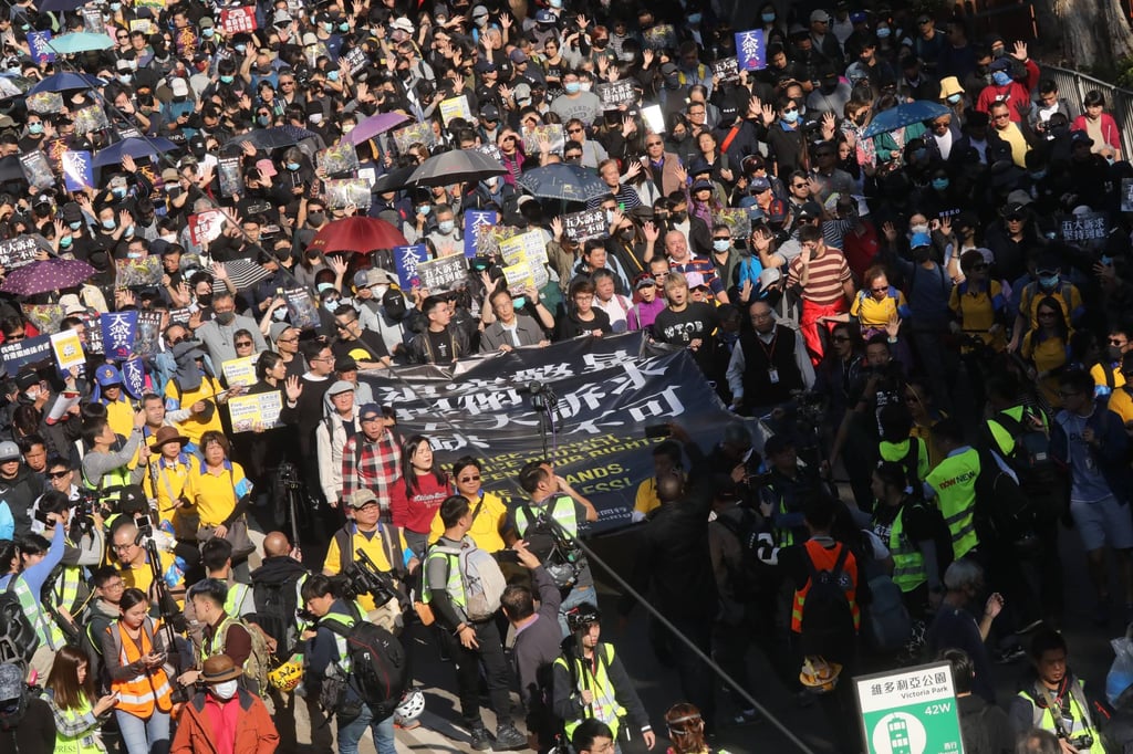 Protesters march through Causeway Bay on December 8, 2019, hours before the attack was slated to begin in Wan Chai. Photo: K. Y. Protesters march through Causeway Bay on December 8, 2019, hours before the attack was slated to begin in Wan Chai. Photo: K. Y.