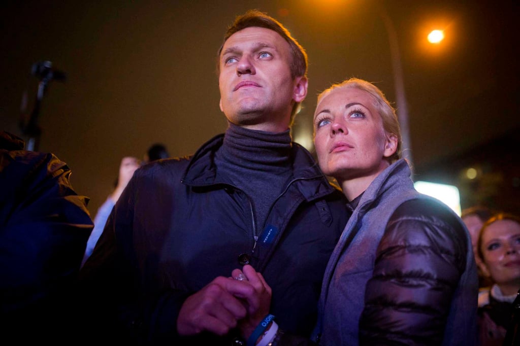 Russian opposition leader Alexei Navalny and his wife, Yulia, are seen after a rally in Moscow, Russia, in September 2013. Photo: AP Russian opposition leader Alexei Navalny and his wife, Yulia, are seen after a rally in Moscow, Russia, in September 2013. Photo: AP