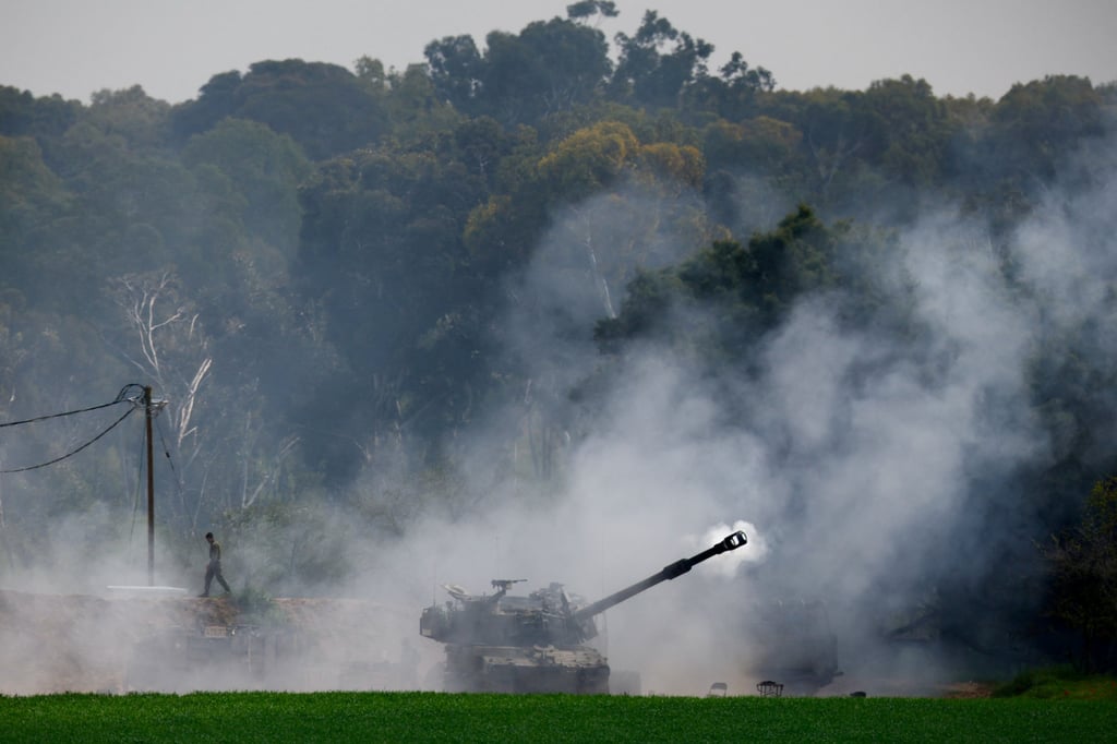An Israeli artillery unit firing towards Gaza. Photo: Reuters