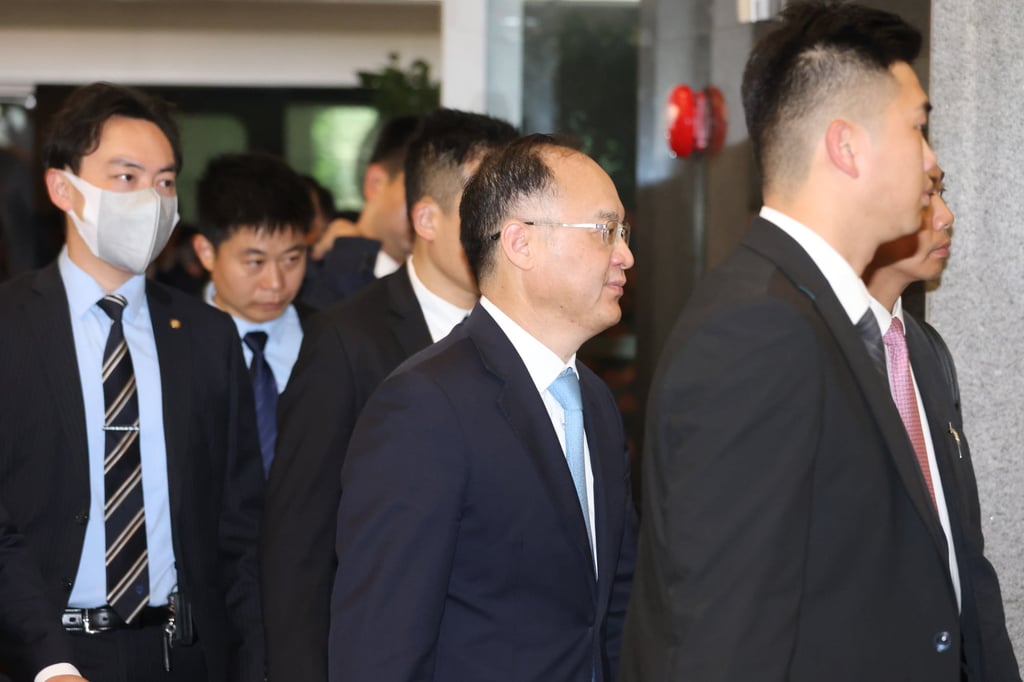 Nong Rong (centre), deputy director of the Hong Kong and Macau Affairs Office (HKMAO), arriving at Hong Kong government headquarters in Admiralty. Photo: Yik Yeung-man Nong Rong (centre), deputy director of the Hong Kong and Macau Affairs Office (HKMAO), arriving at Hong Kong government headquarters in Admiralty. Photo: Yik Yeung-man