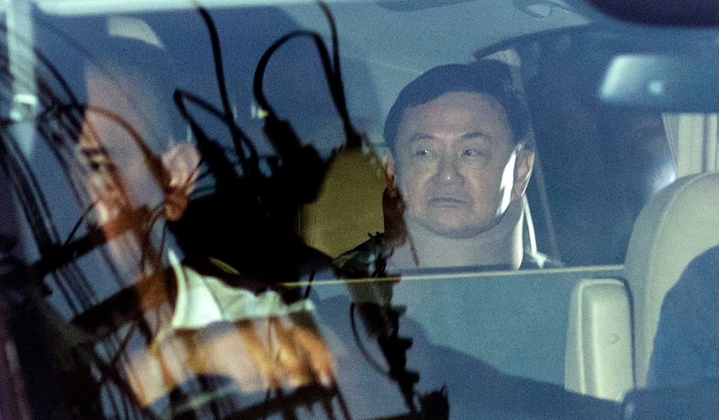 Former Thai prime minister Thaksin Shinawatra sits in a vehicle in front of his residence after being released on parole last Sunday in Bangkok. Photo: AP Former Thai prime minister Thaksin Shinawatra sits in a vehicle in front of his residence after being released on parole last Sunday in Bangkok. Photo: AP