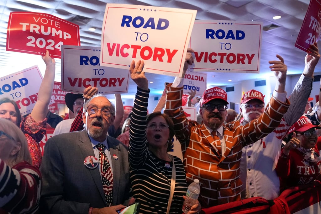 Supporters cheer as Republican presidential candidate Donald Trump speaks at a primary election night party at the South Carolina State Fairgrounds in Columbia on Saturday. Photo: AP Supporters cheer as Republican presidential candidate Donald Trump speaks at a primary election night party at the South Carolina State Fairgrounds in Columbia on Saturday. Photo: AP