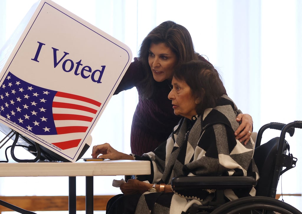 Republican presidential candidate Nikki Haley helps her mother, Raj Kaur Randhawa, cast her ballot in the South Carolina Republican primary on Saturday. Photo: AFP Republican presidential candidate Nikki Haley helps her mother, Raj Kaur Randhawa, cast her ballot in the South Carolina Republican primary on Saturday. Photo: AFP