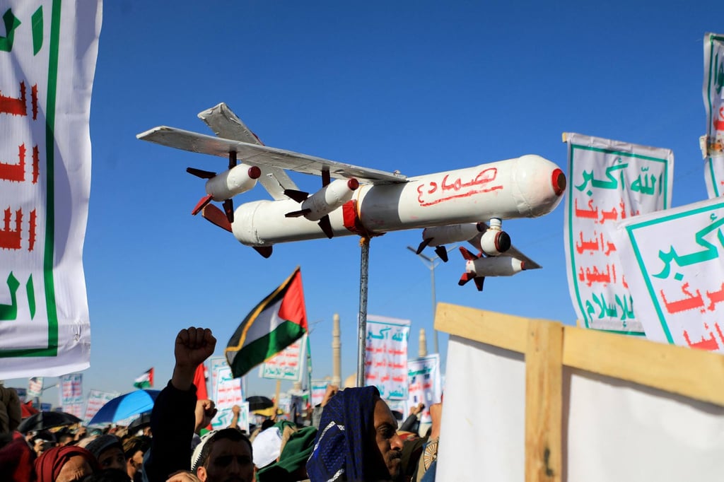 A demonstrator carries a mock drone during a rally in the Houthi-run capital Sanaa in Yemen on Friday. Photo: AFP