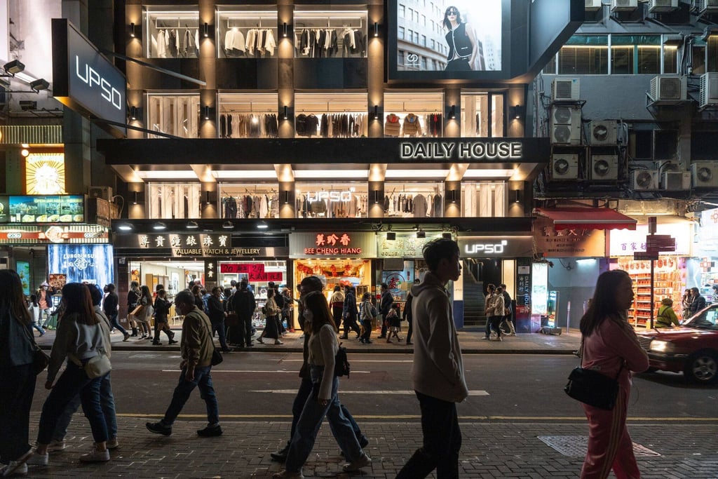 Pedestrians walk by stores during the Lunar New Year holiday in the Tsim Sha Tsui area of Hong Kong, on February 12. Photo: Bloomberg Pedestrians walk by stores during the Lunar New Year holiday in the Tsim Sha Tsui area of Hong Kong, on February 12. Photo: Bloomberg