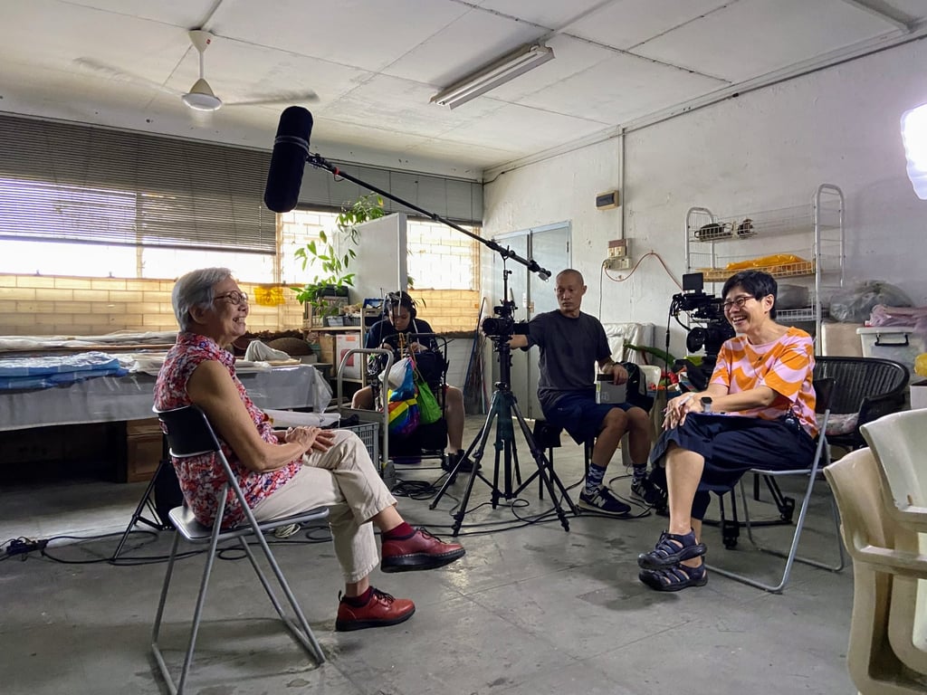 Tan (right) interviews Singaporean performance artist Amanda Heng for walk walk. Photo: Tan Pin Pin