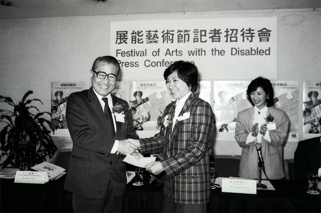 Dr Harry Fang Sin-yang (left), chairman of the Hong Kong Joint Council for the Physically and Mentally Handicapped, presents a cheque to Dr Henrietta Ip, chairwoman of the Festival of Arts with the Disabled Organising Committee, in 1986. Photo: SCMP Dr Harry Fang Sin-yang (left), chairman of the Hong Kong Joint Council for the Physically and Mentally Handicapped, presents a cheque to Dr Henrietta Ip, chairwoman of the Festival of Arts with the Disabled Organising Committee, in 1986. Photo: SCMP
