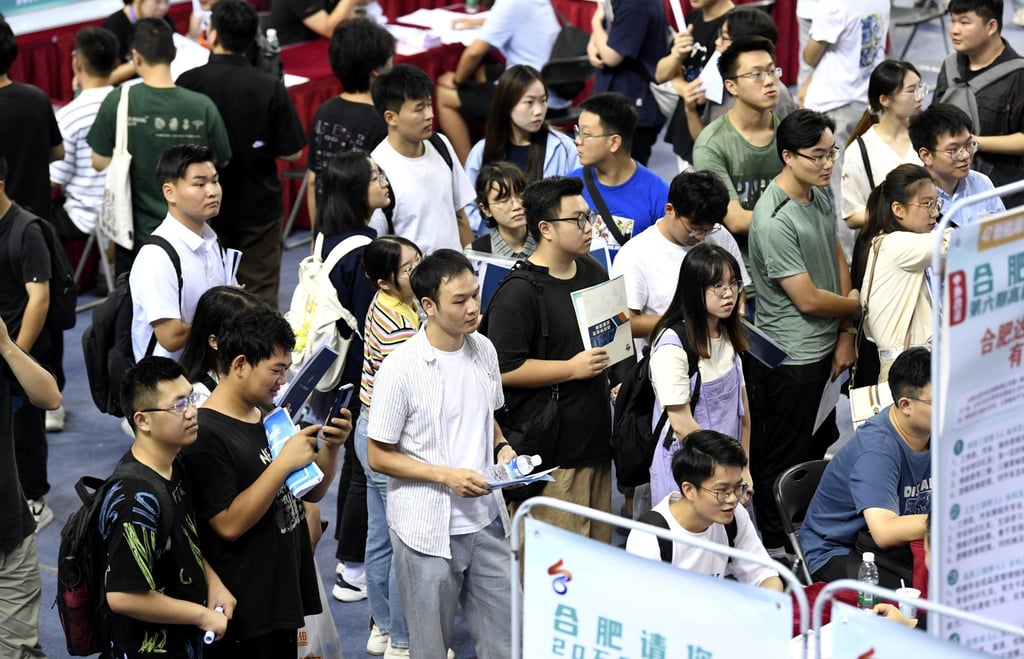 Young people attend a job fair in China. The country’s tight job market has spawned a growing army of online employment fraudsters. Photo: Reuters