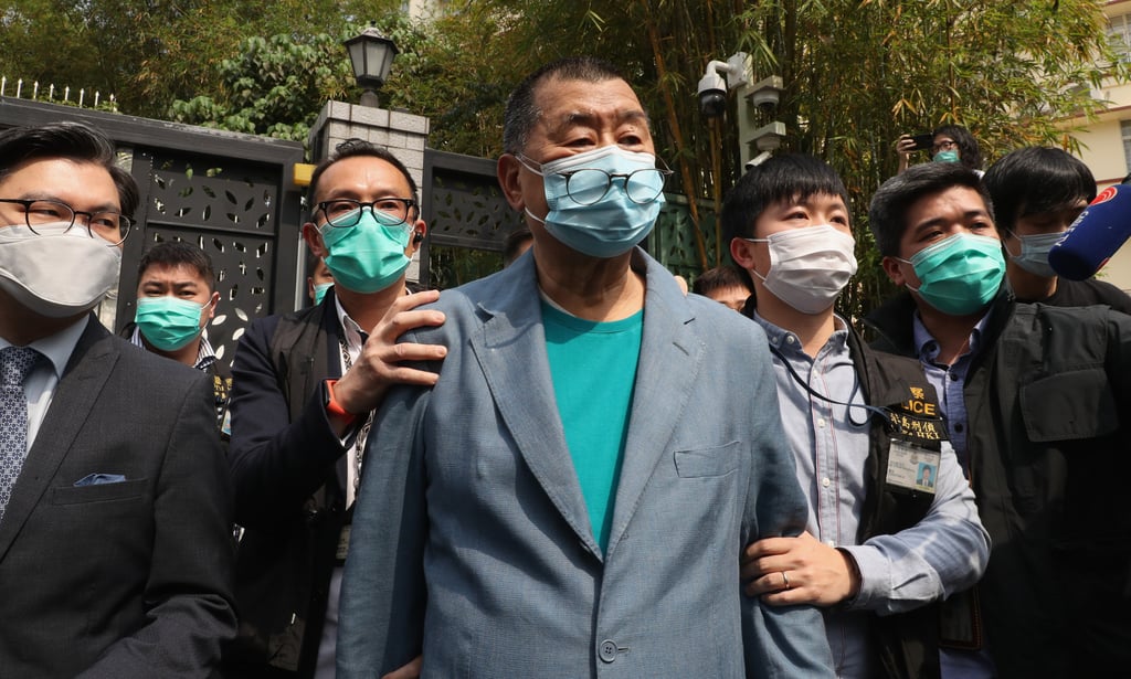 Apple Daily founder Jimmy Lai (centre) is arrested at his home in 2020. Photo: Edmond So Apple Daily founder Jimmy Lai (centre) is arrested at his home in 2020. Photo: Edmond So