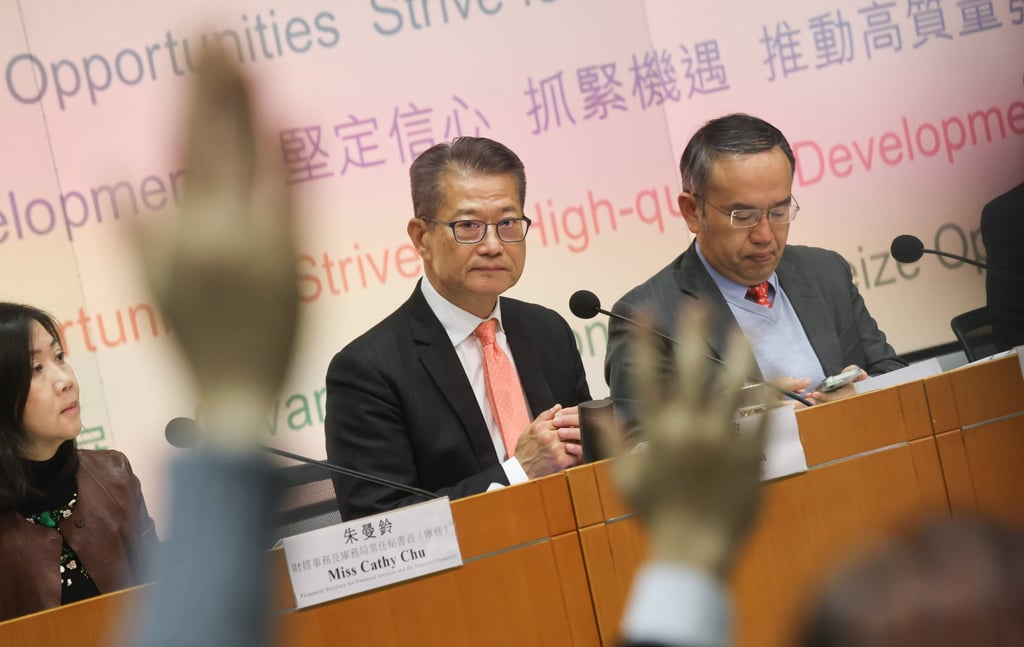 Financial Secretary Paul Chan (centre) says good business for the travel industry can have a trickle-down effect for other sectors. Photo: Jonathan Wong Financial Secretary Paul Chan (centre) says good business for the travel industry can have a trickle-down effect for other sectors. Photo: Jonathan Wong