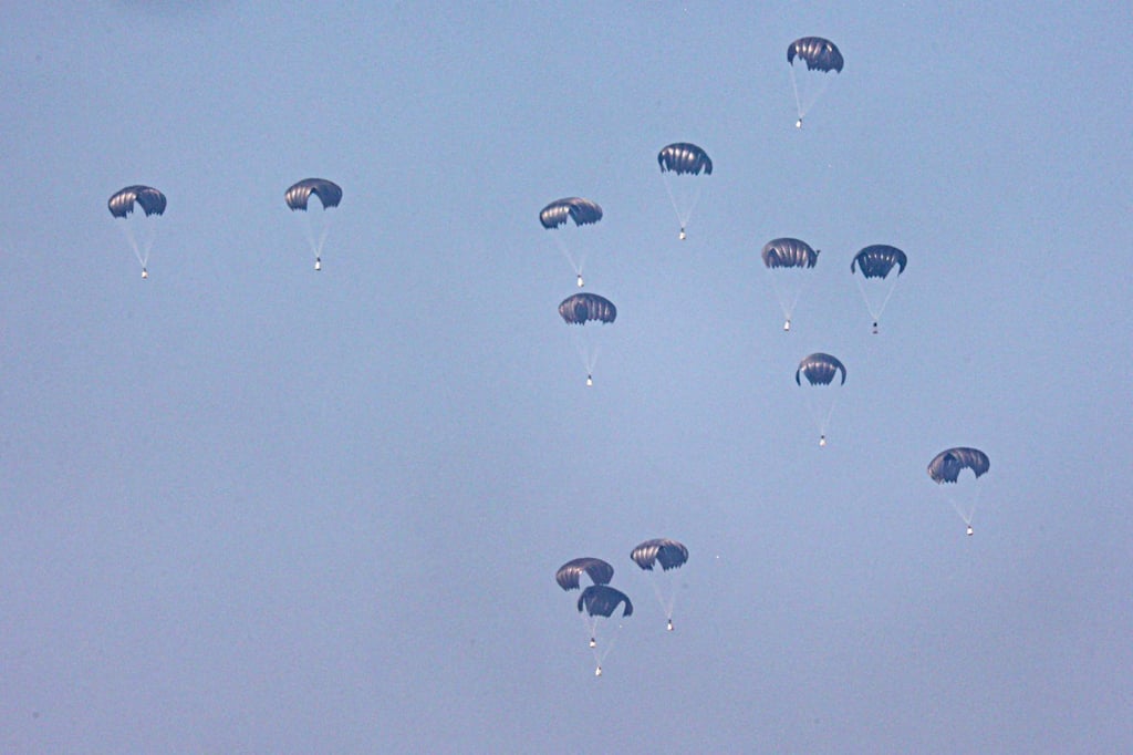 A Jordanian military aircraft drops humanitarian aid over Rafah and Khan Younis, southern Gaza Strip. Photo: AFP A Jordanian military aircraft drops humanitarian aid over Rafah and Khan Younis, southern Gaza Strip. Photo: AFP