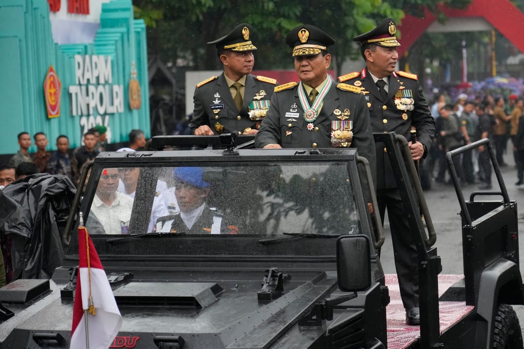 Indonesian Defence Minister Prabowo Subianto, centre, inspects the army after receiving the honorary four-star general rank from President Joko Widodo on Wednesday. Photo: AP