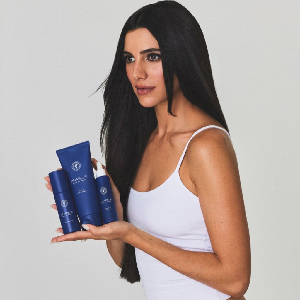 Lauren Perez showing off three argan-rich products from her haircare line Anablue. Photo: @laurenperez/Instagram
