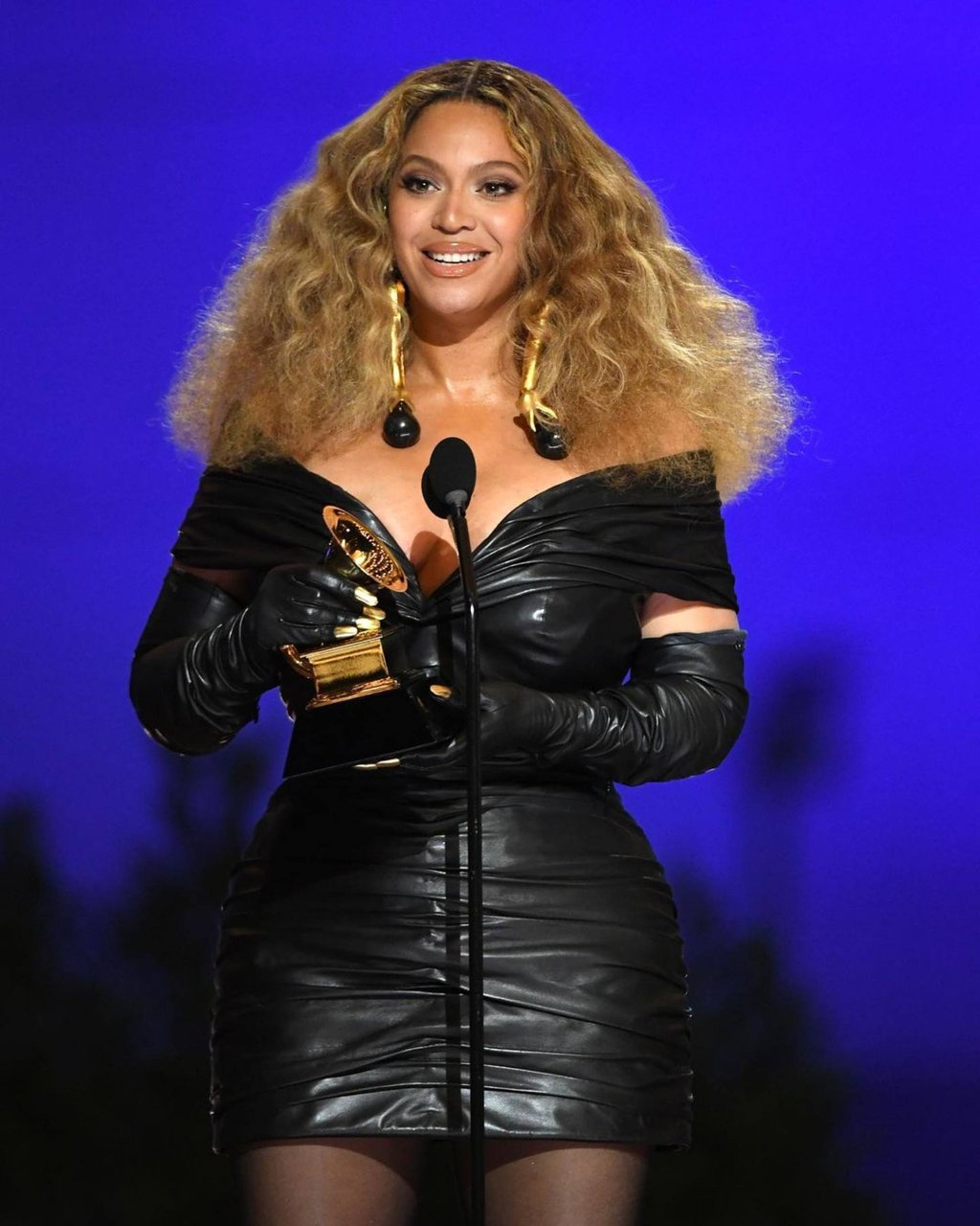 Beyoncé wore a custom Schiaparelli dress and a pair of Thomasine Barnekow leather gloves with gold fingernails at the 2021 Grammys. Photo: @recordingacademy/Instagram