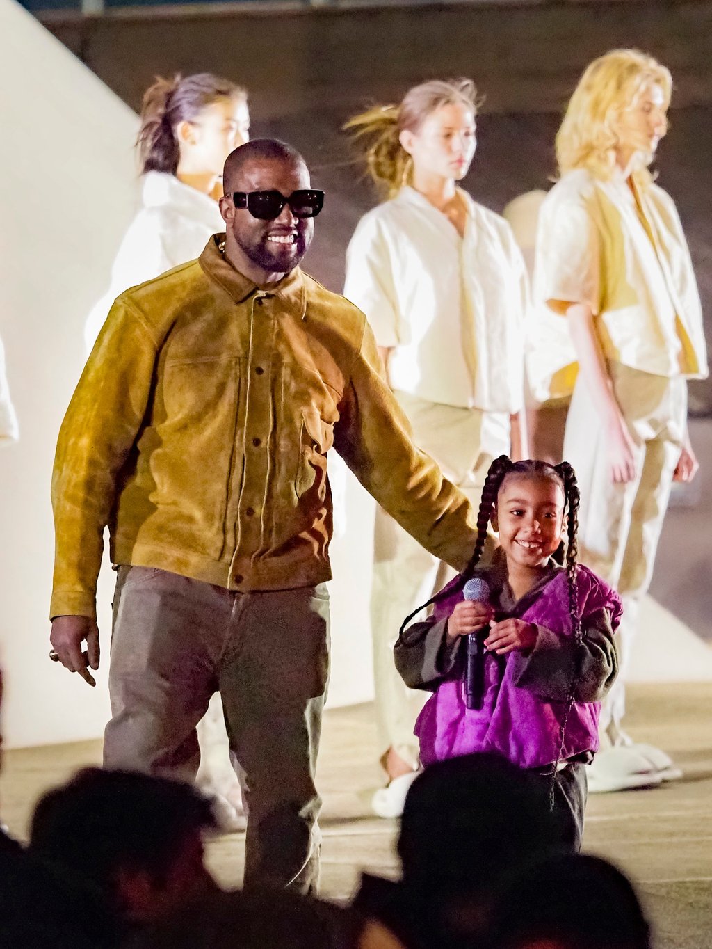 Kanye West with a young North West at one of his fashion shows. Photo: Getty Images