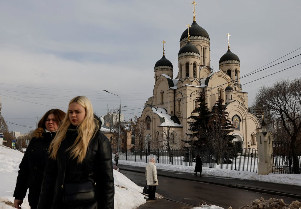 People on Thursday walk past the Church of the Icon of the Mother of God in Moscow, where the funeral service for Alexei Navalny is expected to be held. Photo: Reuters People on Thursday walk past the Church of the Icon of the Mother of God in Moscow, where the funeral service for Alexei Navalny is expected to be held. Photo: Reuters