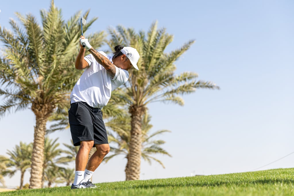 Wild card player, Anthony Kim hits an approach during the first round of LIV Golf Jeddah. Photo: LIV Golf