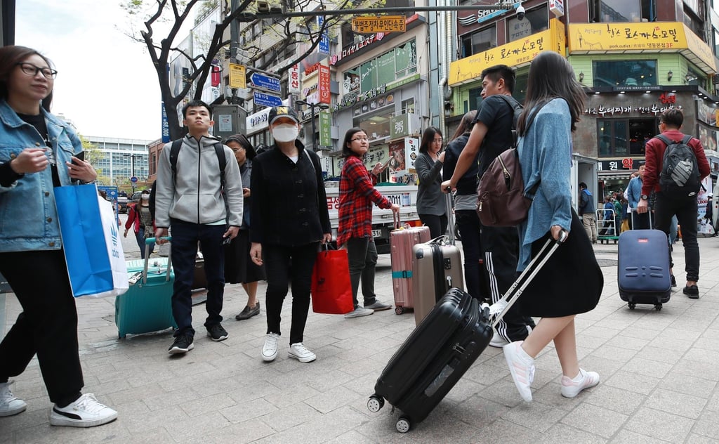 Chinese tourists in Myeongdong, Seoul. Tourist complaints have risen, particularly regarding the exorbitant prices of functional foods sold at souvenir shops. Photo: EPA-EFE/Yonhap Chinese tourists in Myeongdong, Seoul. Tourist complaints have risen, particularly regarding the exorbitant prices of functional foods sold at souvenir shops. Photo: EPA-EFE/Yonhap