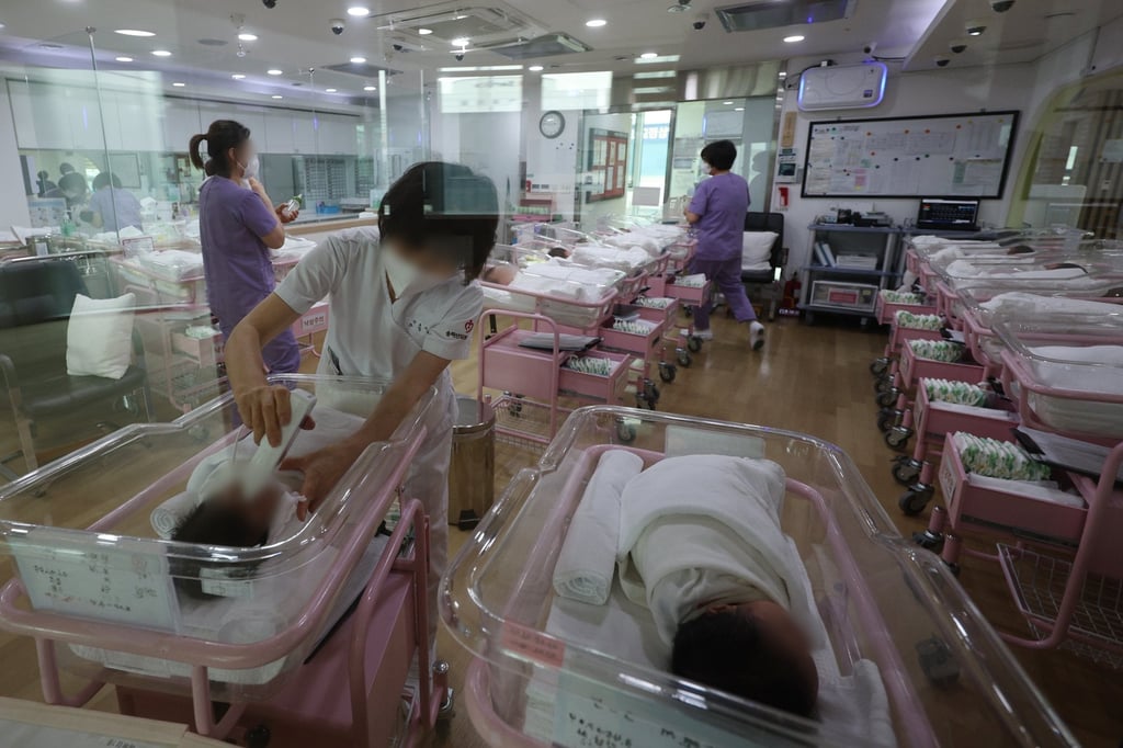 Nurses take care of babies at a postnatal care centre in Seoul. Photo: EPA-EFE/Yonhap Nurses take care of babies at a postnatal care centre in Seoul. Photo: EPA-EFE/Yonhap