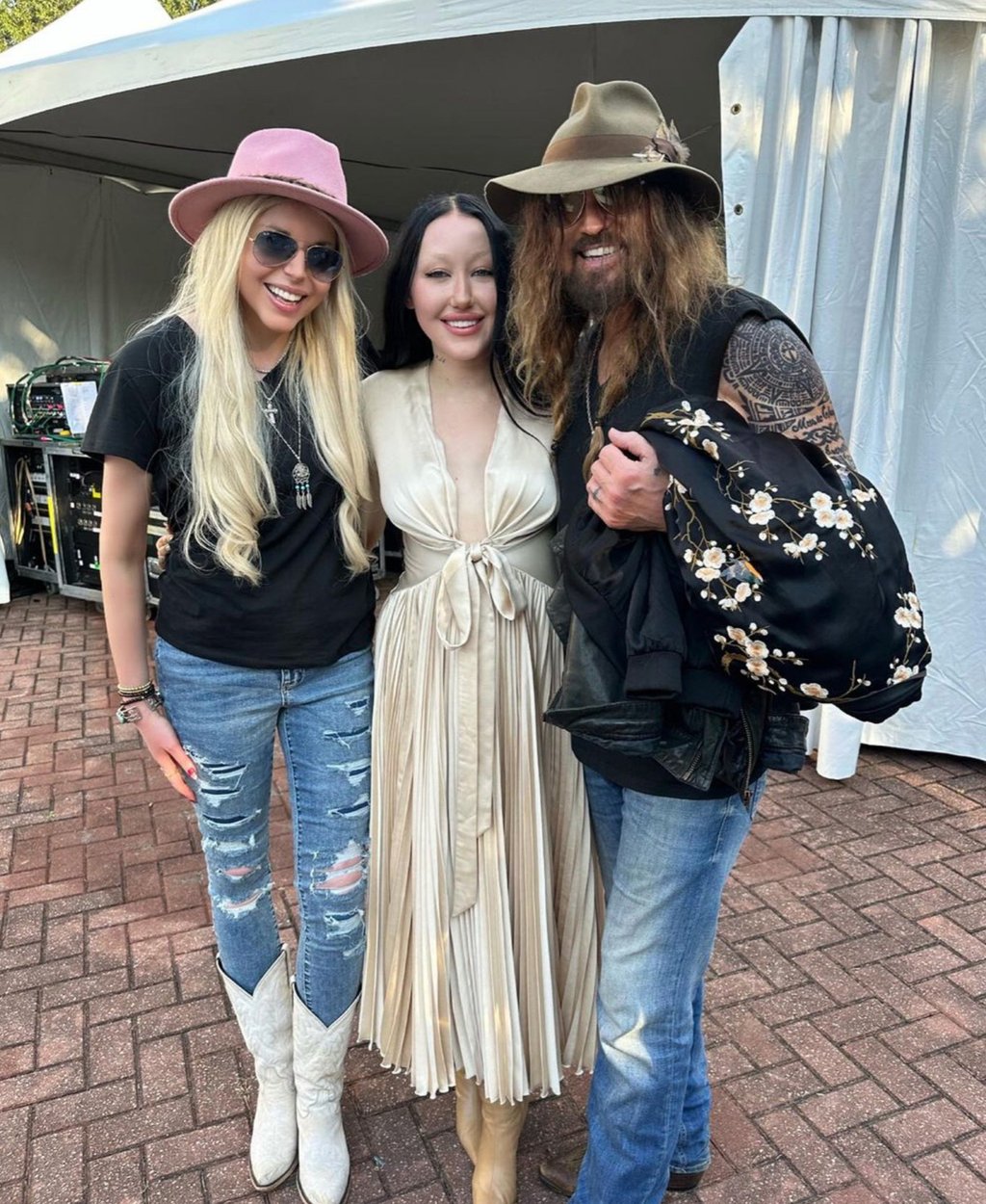 Noah Cyrus (centre) with her dad Billy Ray Cyrus (right) and his new wife Firerose (left). Photo: @billyraycyrus/Instagram Noah Cyrus (centre) with her dad Billy Ray Cyrus (right) and his new wife Firerose (left). Photo: @billyraycyrus/Instagram