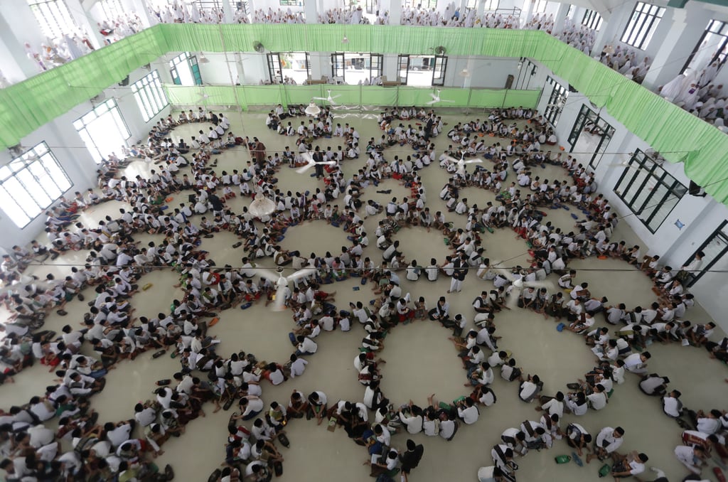 Students at a “pesantren” read the Koran during the holy fasting month of Ramadan in Medan, Indonesia. Photo: Reuters