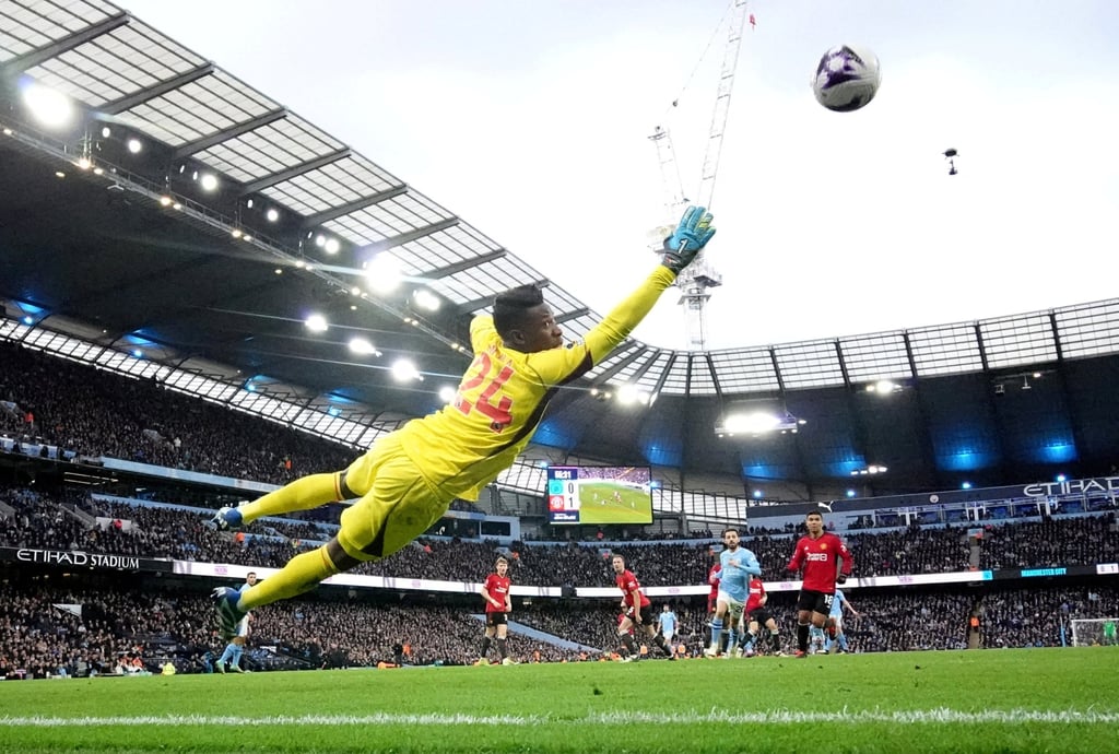 City’s Phil Foden scores their first goal past United keeper Andre Onana. Photo: Reuters City’s Phil Foden scores their first goal past United keeper Andre Onana. Photo: Reuters