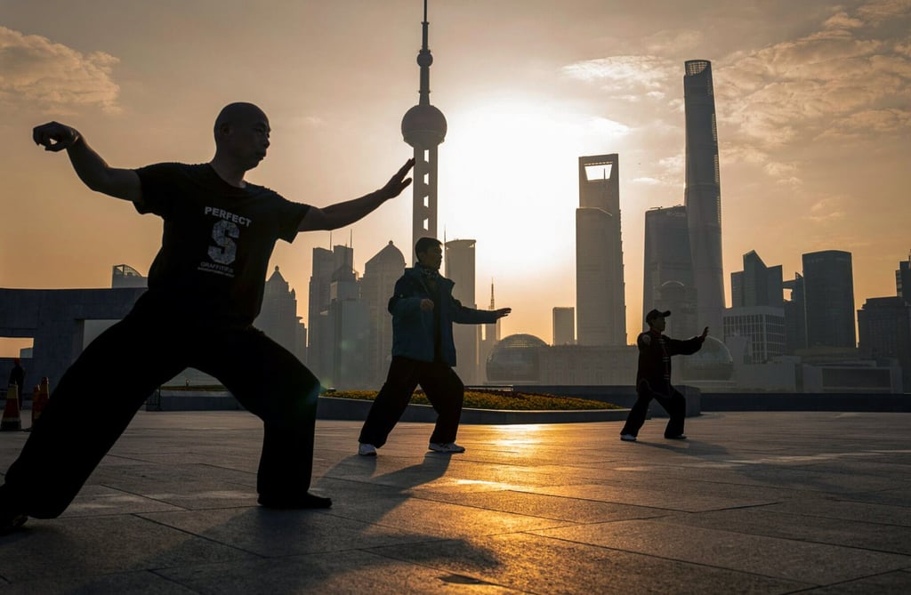People practice tai chi in front of buildings in Pudong’s Lujiazui Financial District in Shanghai on February 19, 2024. Photo: Bloomberg People practice tai chi in front of buildings in Pudong’s Lujiazui Financial District in Shanghai on February 19, 2024. Photo: Bloomberg