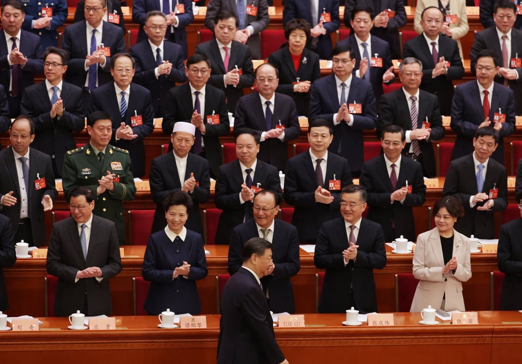 Chinese President Xi Jinping (front) arrives at the Great Hall of the People. Zhang Xiaoming is seated leftmost in the second row from the top. Photo: EPA-EFE