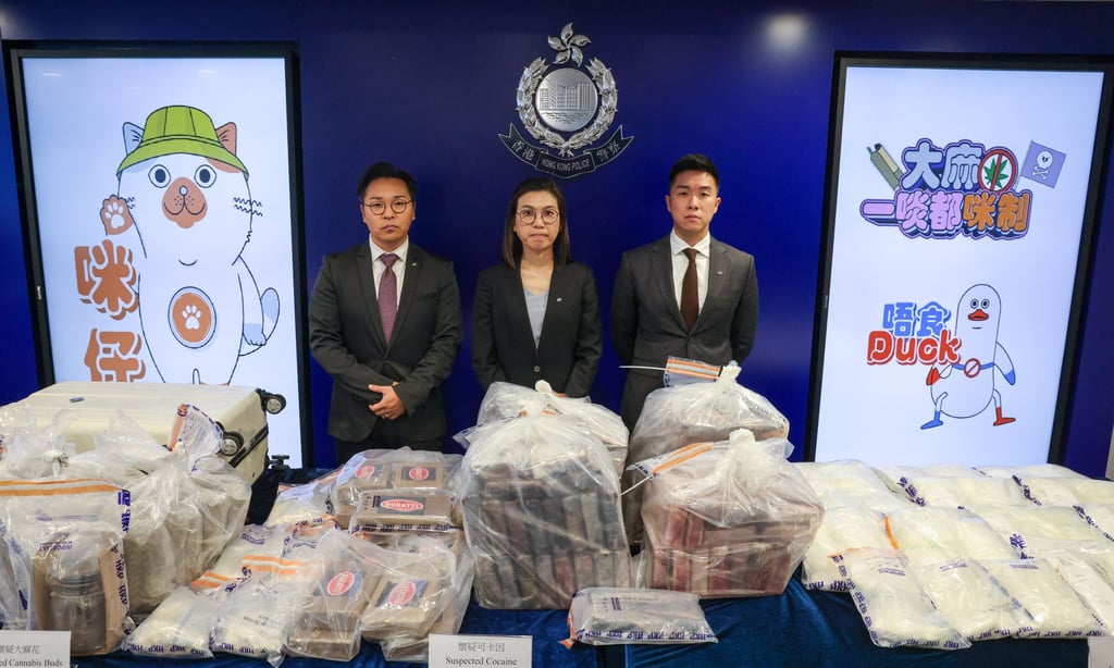 Superintendent Wilson Tam (left) and other officers with evidence seized during the operation. Photo: Jelly Tse Superintendent Wilson Tam (left) and other officers with evidence seized during the operation. Photo: Jelly Tse