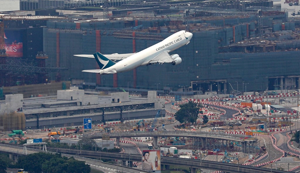 A Cathay Pacific Airways cargo plane takes off as the third runway is under construction at Hong Kong International Airport in Chek Lap Kok. Photo: Yik Yeung-man