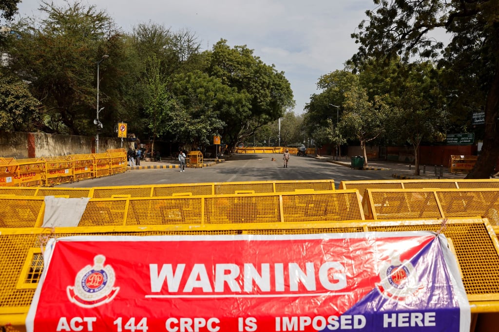 A security personnel stands guard near barricades on a road in Jantar Mantar, India, to stop a protest called by farmers who are marching towards New Delhi to press for the better crop prices promised to them in 2021, on Wednesday. Photo: Reuters A security personnel stands guard near barricades on a road in Jantar Mantar, India, to stop a protest called by farmers who are marching towards New Delhi to press for the better crop prices promised to them in 2021, on Wednesday. Photo: Reuters