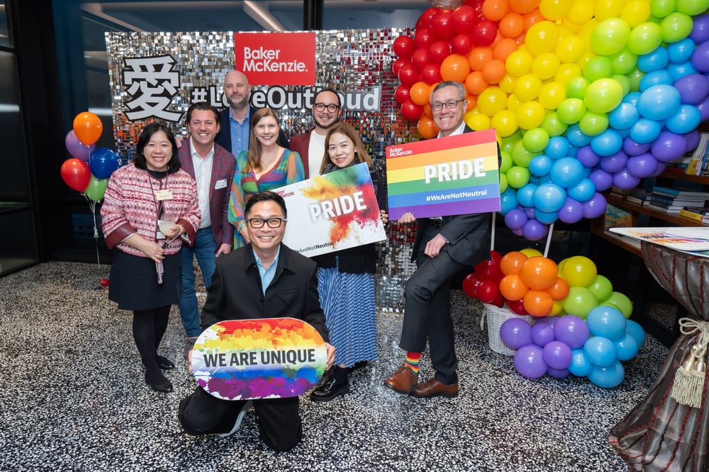 Tan (front) at his law firm’s “Love Out Loud” event. He leads LGBTQ initiatives across the region for the firm. Tan (front) at his law firm’s “Love Out Loud” event. He leads LGBTQ initiatives across the region for the firm.