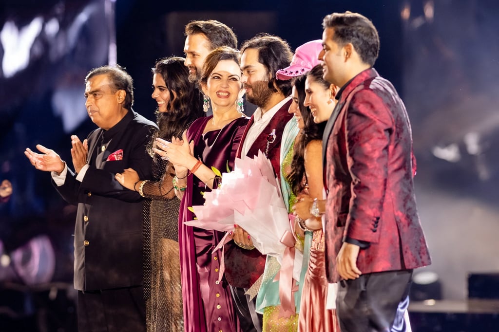 Mukesh Ambani, the chairman of Reliance Industries, Isha Piramal, Anand Piramal, Nita Ambani, Anant Ambani, Rihanna, Radhika Merchant, Shloka Mehta Ambani and Akash Ambani stand on the stage during pre-wedding celebrations of Anant and Radhika in Jamnagar, Gujarat, India, on March 1. Photo: Reliance Industries/Handout via Reuters Mukesh Ambani, the chairman of Reliance Industries, Isha Piramal, Anand Piramal, Nita Ambani, Anant Ambani, Rihanna, Radhika Merchant, Shloka Mehta Ambani and Akash Ambani stand on the stage during pre-wedding celebrations of Anant and Radhika in Jamnagar, Gujarat, India, on March 1. Photo: Reliance Industries/Handout via Reuters
