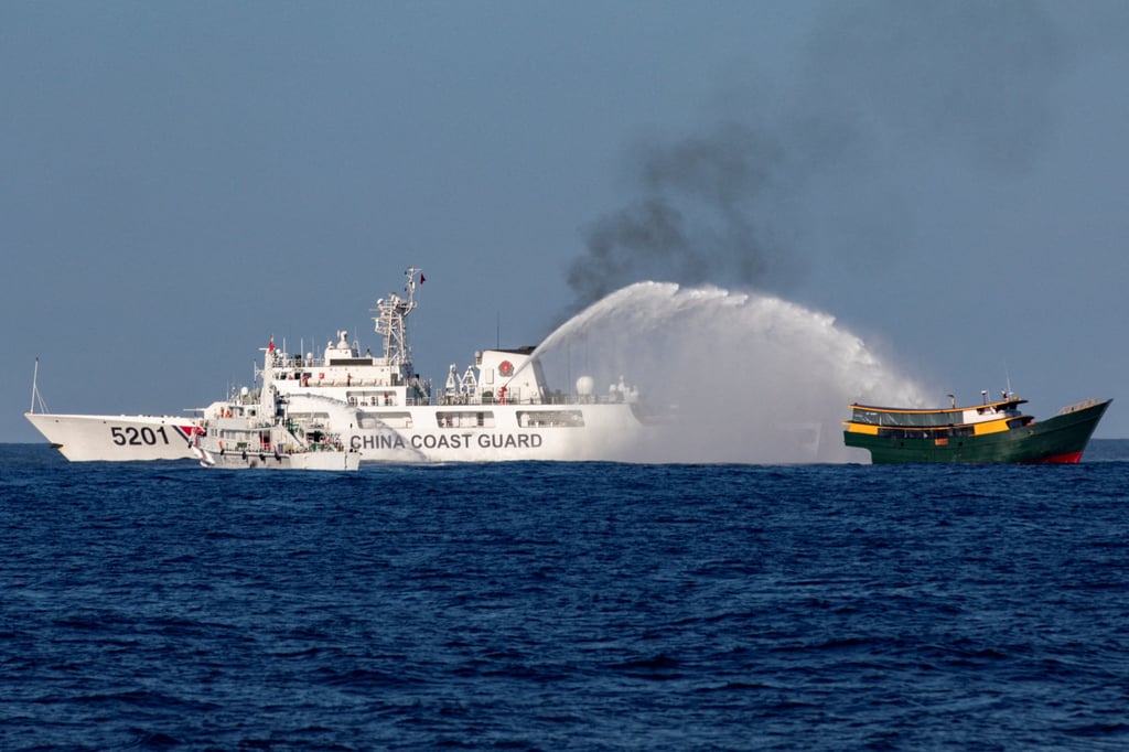 Chinese coastguard vessels fire water cannons towards a Philippine resupply vessel on March 5 in the South China Sea. Photo: Reuters Chinese coastguard vessels fire water cannons towards a Philippine resupply vessel on March 5 in the South China Sea. Photo: Reuters