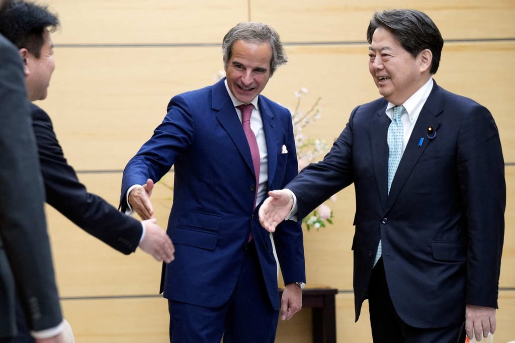 International Atomic Energy Agency director general Rafael Mariano Grossi (middle) introduces his staff to Japan’s Chief Cabinet Secretary Yoshimasa Hayashi (right) at the prime minister’s office in Tokyo. Photo: AFP International Atomic Energy Agency director general Rafael Mariano Grossi (middle) introduces his staff to Japan’s Chief Cabinet Secretary Yoshimasa Hayashi (right) at the prime minister’s office in Tokyo. Photo: AFP