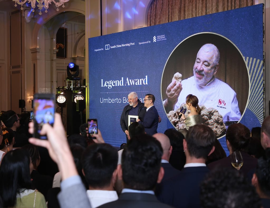 Chef Umberto Bombana receiving his 100 Top Tables 2024 Legend Award from SCMP’s COO Kevin Huang. The South China Morning Post’s annual fine dining guide and awards ceremony took place at The Peninsula Hong Kong on Monday, March 11. Photo: The Mark Studio and Kong Yat-pang