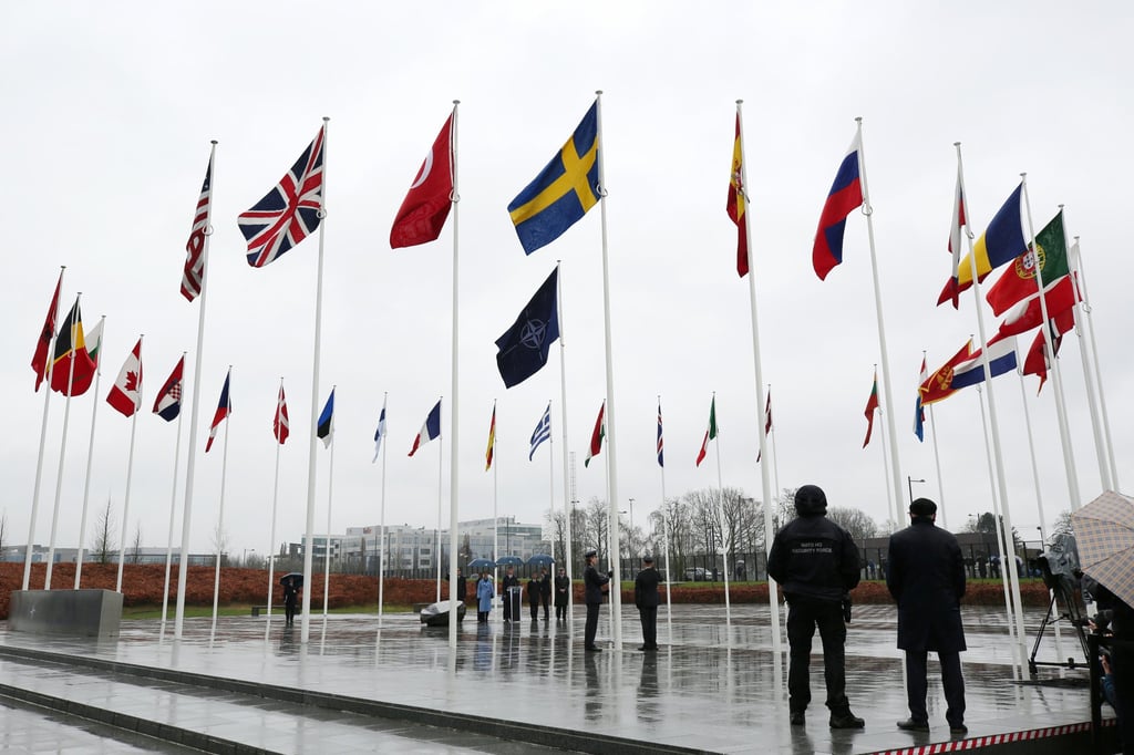 Sweden’s flag is raised at Nato headquarters in Brussels, at a ceremony for its accession to the bloc. Photo: Xinhua