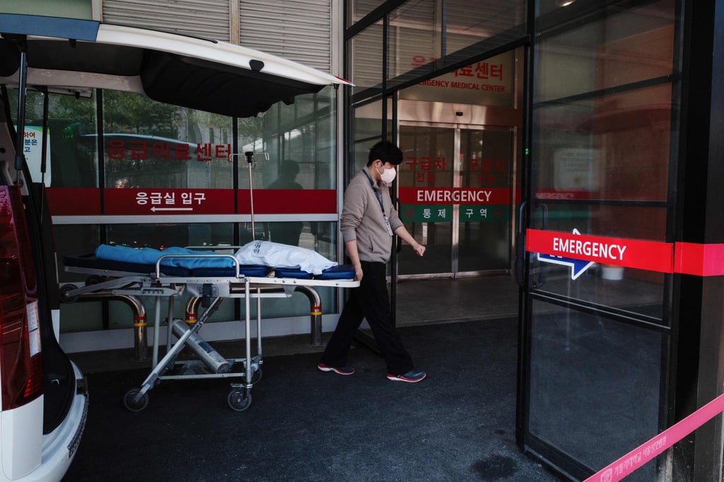 A medical worker rolls a stretcher into a hospital in Seoul on Wednesday. Photo: AFP A medical worker rolls a stretcher into a hospital in Seoul on Wednesday. Photo: AFP